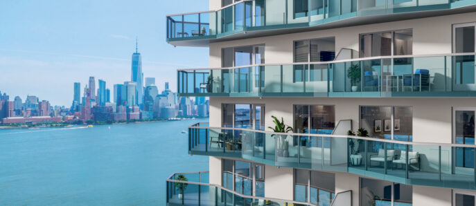 Modern balconies overlooking an urban skyline. The glass balustrades provides an unobstructed view, enhancing the seamless indoor-outdoor transition.