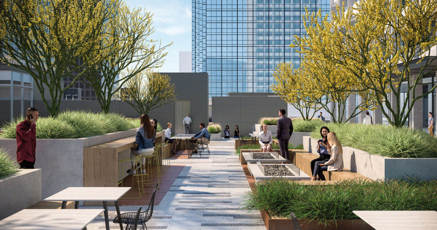 Rooftop patio with integrated greenery and wooden benches amidst a high-rise urban backdrop. Patrons enjoy conversation, with individual and group seating arrangements, under the shade of flourishing yellow trees. The design balances nature and modernity, providing a serene communal space in the heart of the city.